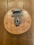 Thumb Piano Gecko Kalimba, Coconut Shell. Fixed Price $10.00.
