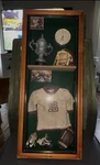 Vintage Football Memorabilia Display Case With Jersey #18, Helmet, Shoes, Trophy. Fixed Price $35.00.