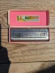 Vintage M. Hohner The Echo Harp Harmonica With Original Box Germany Cg. Fixed Price $25.00.
