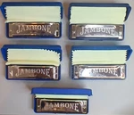 5X Jambone By Axl. Keys Of A, D, E, F, G Ten Hole Harmonicas In Cases. Fixed Price $26.99.