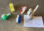 Lot Of 4 Vintage 1.75" Plastic Whistles, Plus One Bird Water Whistle, All Work!. Fixed Price $9.99.