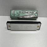 Adventurer's Campfire Harmonica In The Key Of House Marbles England. Fixed Price $17.95.