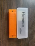 Vintage Toysmith Harmonica Translucent Orange Case. Fixed Price $13.50.
