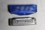 1 M. Hohner 4" Long Blues Harmonica Original Case. Fixed Price $19.00.