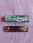 Adventurer's Campfire Harmonica In The Key Of House Marbles England. Fixed Price $10.00.