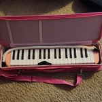 D'luca Melodica 32-KEY Pink Plastic With Case, Mouthpiece, Flexible Blow Pipe. Fixed Price $15.00.