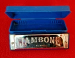 Jambone By Axl -- Key Of D Ten Hole Harmonica In Case Euc. Fixed Price $12.99.